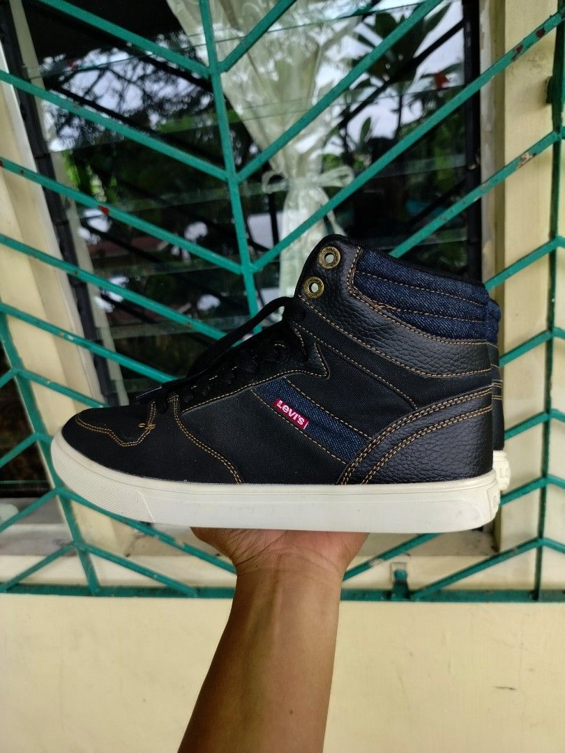 Levi's Black High Top Sneakers Size 9.5 (Category: Sneakers) located in Manila. Submitted by gerald_quinto (Listing ID 1465482281, Image 2). Description: - Brand: Levi's - Style: High top sneakers - Size: 9.5 (marked on interior tongue tag) - Color: Black with white rubber outsoles and black laces - Details: Contrast stitching, stylish denim accent panels, and signature red Levi's tab on the side - Condition: Excellent buyer-friendly everyday foo