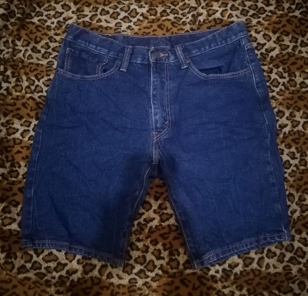 Levi's Dark Blue Denim Shorts (Category: Shorts) located in Cebu City. Submitted by roadthrift (Listing ID 1465401635, Image 1). Description: - Brand: Levi's - Color: Dark blue denim - Fit: Standard fit - Details: Classic five-pocket design with button fly - Material: Sturdy denim fabric - Condition: Great for casual everyday wear in warmer weather - Origin: Made in China - W34-36 x L20.5.