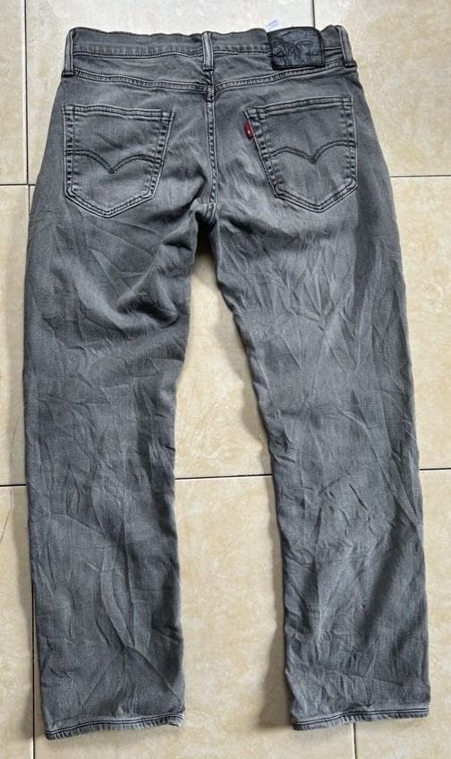 Levi's 511 Slim fit Jeans size 32(FREE SHIP) (Category: Jeans) located in General Santos City (Dadiangas). Submitted by moana_thrifts (Listing ID 1465408322, Image 2). Description: - Brand: Levi's - Color: Grey - Size: W32 L32 - Closure: Button fly with branded metal hardware - Details: Classic five-pocket styling, signature red tab on back pocket, black leather waistband patch - Condition: Versatile daily wear.