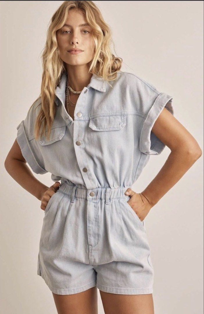 light wash denim short romper jumpsuit (Category: Rompers) located in Manila. Submitted by decluterthings888 (Listing ID 1465397489, Image 2). Description: - Style: Light wash denim short jumpsuit / romper - Details: Collared neck, button-front closure, rolled sleeve cuffs - Fit: Fitted waist with comfortable elastic and belt loops - Pockets: Functional chest pockets, front pockets, and back pockets - Condition: Excellent, ready to wear - Perfect