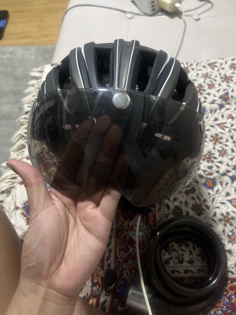 Lixada Cycling Helmet with Detachable Visor (Category: Bicycles) located in Pasig City. Submitted by jnzmrq1003 (Listing ID 1465519721, Image 2). Description: - Brand: Lixada - Color: Black and grey with white stripes - Includes a tinted magnetic detachable visor - Excellent ventilation with multiple top and side air vents - Adjustable straps with reflective details for night safety - Perfect for road cycling and daily commuting - Condition: Exce