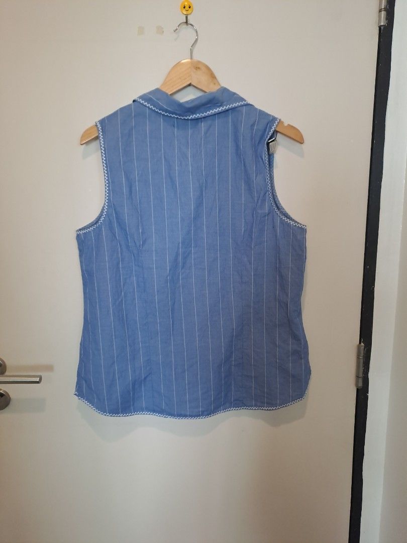 Liz Claiborne (Category: Sleeveless) located in Manila. Submitted by joanbalde39643 (Listing ID 1465438875, Image 3). Description: This is a vintage Liz Claiborne sleeveless button-up top featuring a blue and white pinstripe pattern, a collared neckline, and delicate white floral lace embroidery details on the front..