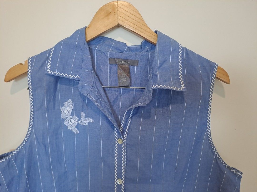 Liz Claiborne (Category: Sleeveless) located in Manila. Submitted by joanbalde39643 (Listing ID 1465438875, Image 2). Description: This is a vintage Liz Claiborne sleeveless button-up top featuring a blue and white pinstripe pattern, a collared neckline, and delicate white floral lace embroidery details on the front..