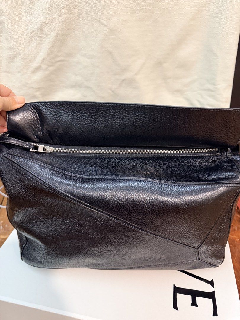 Loewe Black Puzzle Edge Bag (Category: Luxury Bags & Wallets) located in Paranaque City. Submitted by rhea_villanueva (Listing ID 1465480427, Image 3). Description: Grained Calfskin Large Puzzle Edge Bag Black Complete with box and dustbag Lightly Used .