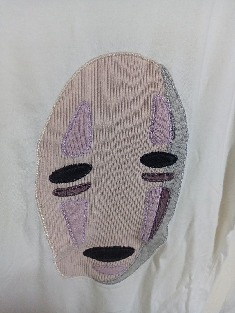 Loewe White Graphic Tee Shirt (Category: Shirts) located in Manila. Submitted by drip-from-thrift (Listing ID 1465578364, Image 2). Description: - Brand: Loewe - Color: Crisp white with pink, grey, and black embroidered mask/face patch - Fit: Standard fit, classic crew neck - Condition: Excellent, well-maintained - Style: Versatile casual wear, perfect for everyday styling.