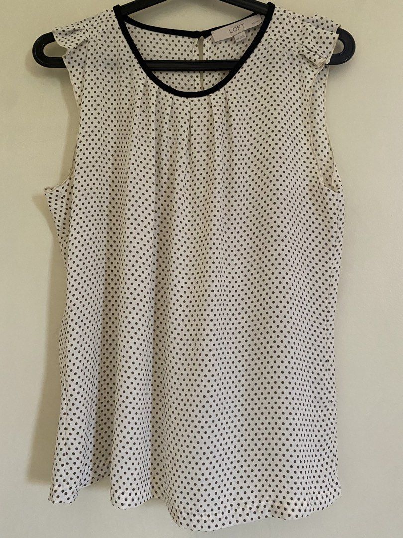 LOFT Polka Dot Ruffle Sleeve Blouse (Category: Blouses) located in Quezon City. Submitted by abssnf (Listing ID 1465396001, Image 1). Description: - Brand: LOFT - Size: SP - Design: White with all-over black polka dots, contrast black neckline trim, and cute shoulder ruffles - Closure: Back keyhole with button - Material: Lightweight and breathable fabric - Perfect for: Office wear, smart casual outings, or pairing with your favorite jeans and tr