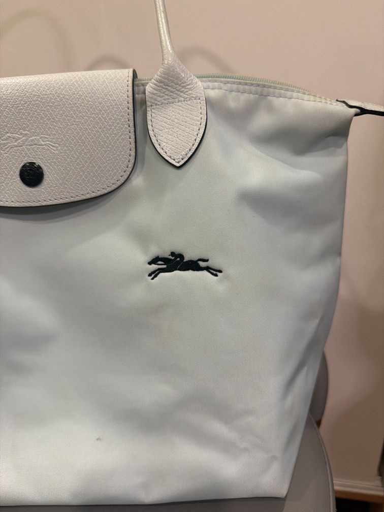 Longchamp Le Pliage Nylon Tote Bag Light Blue (ORIGINAL) (Category: Luxury Bags & Wallets) located in Pasig City. Submitted by bernamascarinas (Listing ID 1464972277, Image 2). Description: Still in good condition.. but theres signs of usage. Bought this for 7,000 selling low - Authentic Longchamp Le Pliage tote bag in a lovely light blue shade - Designed with long shoulder straps for comfortable everyday wear - Secure top zipper and snap flap cl
