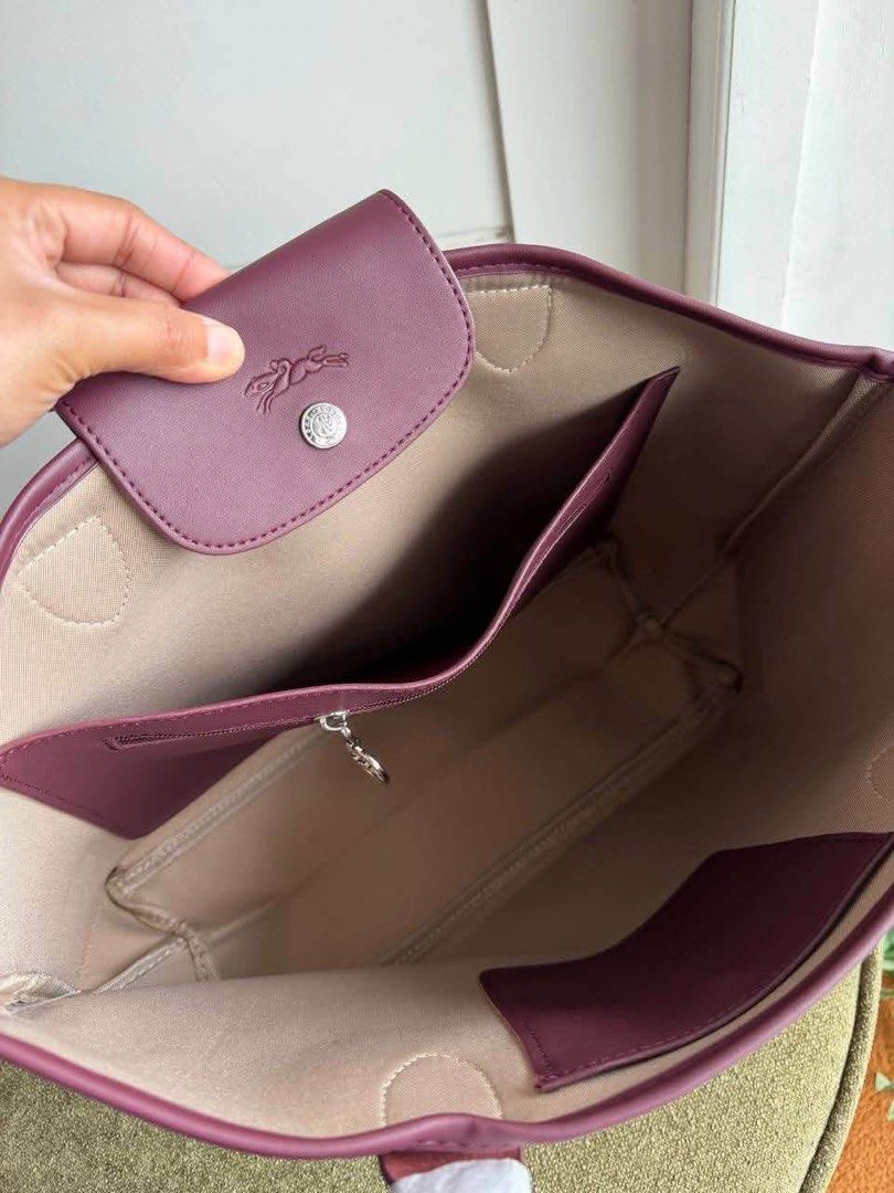 Longchamp Tote Large (Category: Luxury Bags & Wallets) located in Manila. Submitted by liahsells (Listing ID 1465404611, Image 2). Description: - Brand: Longchamp - Colors: Black, Beige, Blue, Orange, Muted Red - Style: Roomy daily tote bag - Features: Double handles (wrapped in protective paper), snap button closure with embossed logo flap - Interior: Light beige fabric lining with 1 zipped pocket and slip compartments - Condition: Brand new .