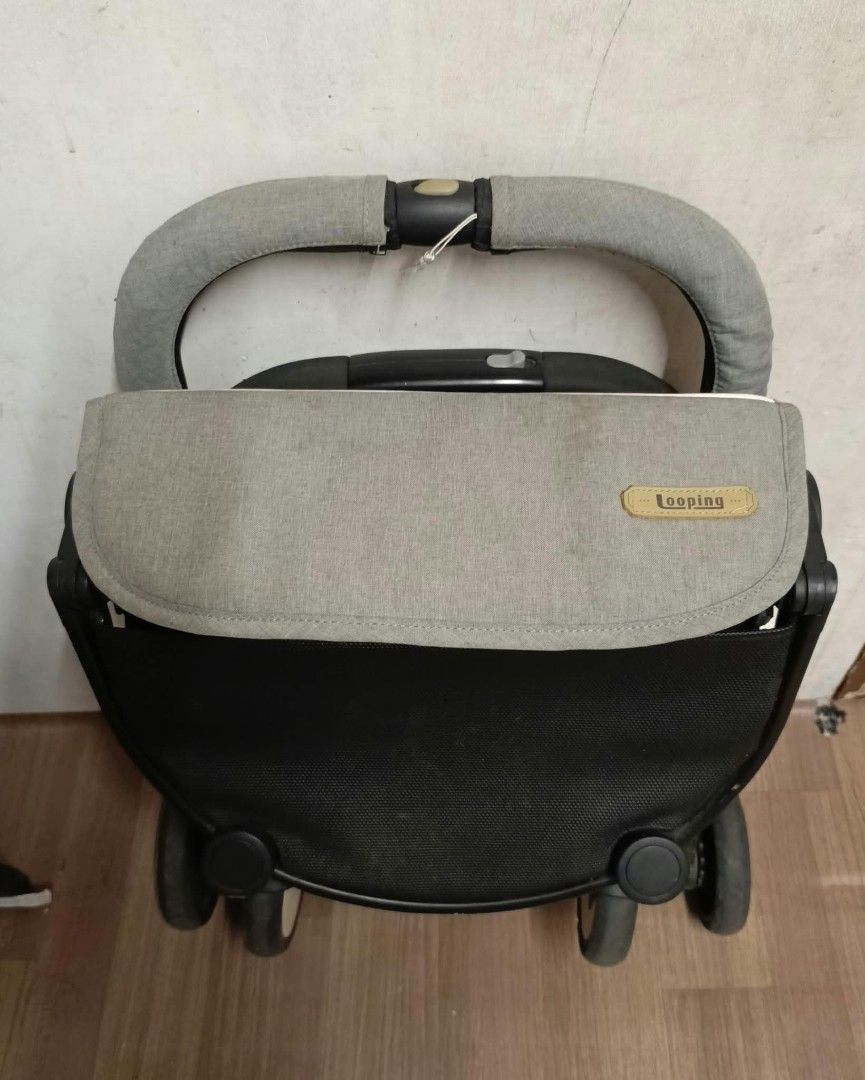 Looping Squizz Stroller Grey Compact Foldable (Category: Strollers) located in Pasay City. Submitted by al1son18 (Listing ID 1465576468, Image 2). Description: Looping Squizz grey stroller. Compact folding design, fits easily in car boots or for travel. Quilted seat padding, adjustable canopy with branding patch. Storage basket underneath. Sturdy black frame with swivel wheels. Easy push handle setup. Normal signs of use on the fabric and frame. 