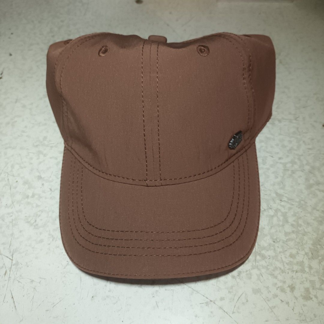 Loro Piana Brown Cap (Category: Caps & Hats) located in Manila. Submitted by itsnik444 (Listing ID 1465578438, Image 1). Description: - Color: Brown with a stylish black metallic logo badge - Material: 100% polyester (clean inside and out) - Fit: One size with an elastic back strap for comfort - Design: Classic curved brim and stitched panel details - Condition: Excellent, ready to wear.