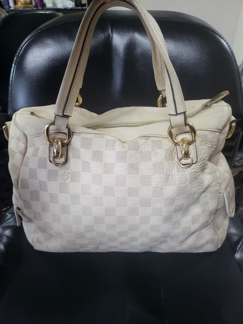 Louis Vuitton Damier Azur Tilsitt Handbag (Category: Luxury Bags & Wallets) located in Manila. Submitted by milkymitch23 (Listing ID 1465403090, Image 1). Description: - Brand: Louis Vuitton - Material: Iconic white Damier Azur canvas with cream leather trim - Hardware: Gold-tone - Closure: Top zipper - Interior: Fabric lining with visible dark stains and marks on the bottom floor - Authenticity: Stamped Louis Vuitton Paris Made in France label i