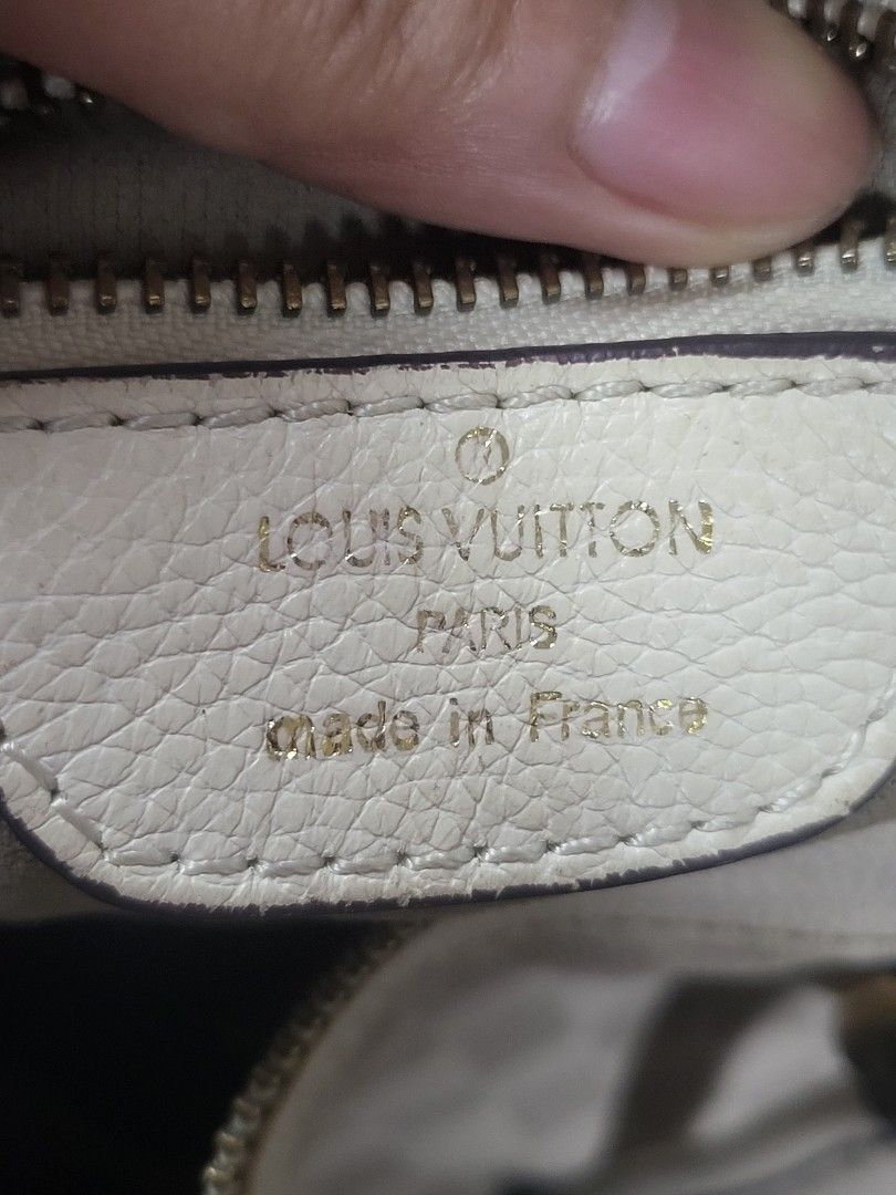 Louis Vuitton Damier Azur Tilsitt Handbag (Category: Luxury Bags & Wallets) located in Manila. Submitted by milkymitch23 (Listing ID 1465403090, Image 3). Description: - Brand: Louis Vuitton - Material: Iconic white Damier Azur canvas with cream leather trim - Hardware: Gold-tone - Closure: Top zipper - Interior: Fabric lining with visible dark stains and marks on the bottom floor - Authenticity: Stamped Louis Vuitton Paris Made in France label i