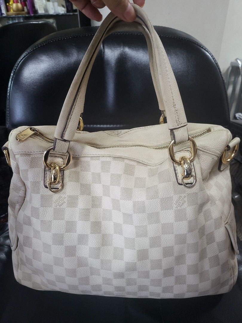 Louis Vuitton Damier Azur Tilsitt Handbag (Category: Luxury Bags & Wallets) located in Manila. Submitted by milkymitch23 (Listing ID 1465403090, Image 2). Description: - Brand: Louis Vuitton - Material: Iconic white Damier Azur canvas with cream leather trim - Hardware: Gold-tone - Closure: Top zipper - Interior: Fabric lining with visible dark stains and marks on the bottom floor - Authenticity: Stamped Louis Vuitton Paris Made in France label i