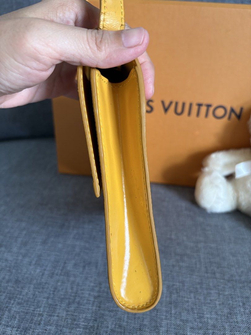Louis Vuitton Epi Leather Yellow Shoulder Bag (Category: Luxury Bags & Wallets) located in Alicia. Submitted by berly06 (Listing ID 1465469577, Image 3). Description: - Authentic Louis Vuitton Epi leather bag in a striking bright yellow - Structured rectangular design with a comfortable long shoulder strap - Secure gold-tone twist lock closure engraved with Louis Vuitton Paris - Durable and textured signature Epi leather grain - Includes original