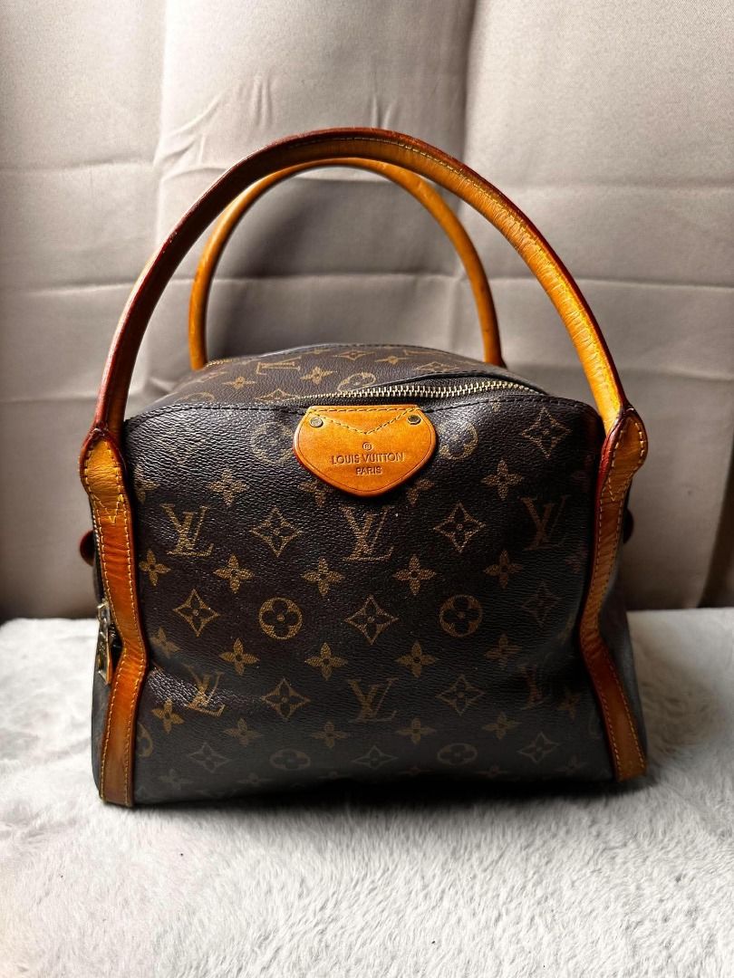 Louis Vuitton Monogram Canvas Handbag (Category: Luxury Bags & Wallets) located in Davao. Submitted by luckyturtle.aa6ccf (Listing ID 1465392657, Image 1). Description: - Classic Louis Vuitton Monogram canvas with rich brown leather handles - Secure top zip closure with dual pull tabs - Structured square base with protective feet and snap-button exterior strap - Spacious deep plum interior lining with Louis Vuitton Paris heat stamp - Premium gold