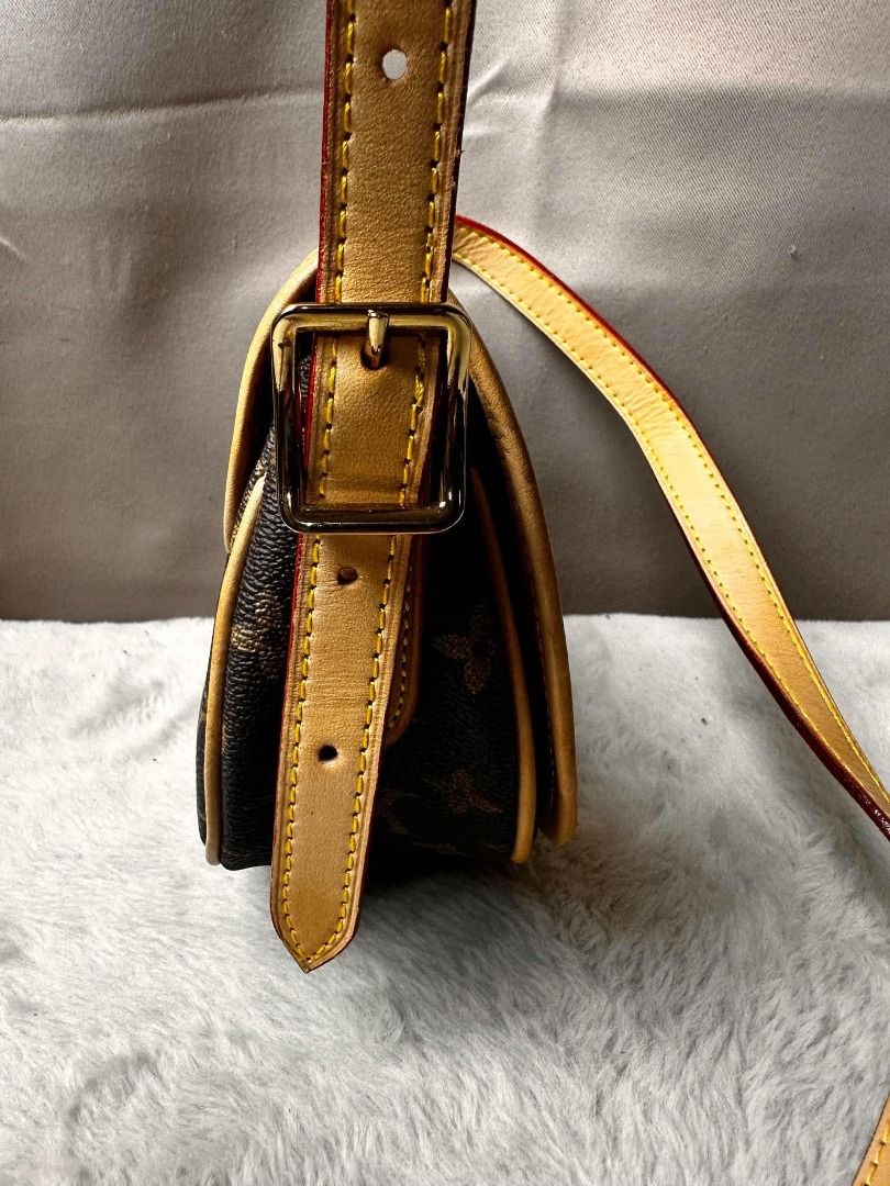 Louis Vuitton Monogram Canvas Saddle Bag Crossbody (Category: Luxury Bags & Wallets) located in Davao. Submitted by luckyturtle.aa6ccf (Listing ID 1465455851, Image 3). Description: - Authentic Louis Vuitton Monogram Saddle Bag - Classic monogram canvas with Vachetta leather trim - Secure flap closure with stylish buckle detail - Vibrant red interior lining with a convenient slip pocket - Elegant gold-tone hardware throughout - Adjustable shoulde