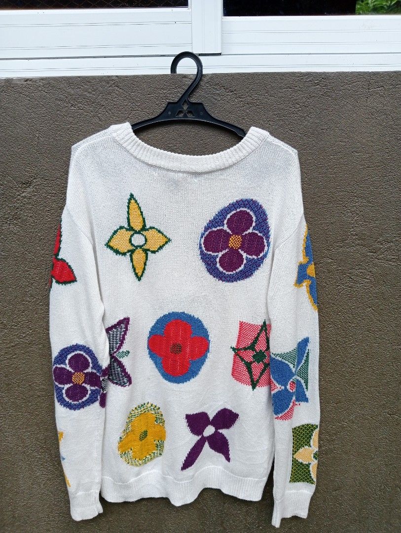 Louis Vuitton Multicolor Monogram Knit Sweater (Category: Longsleeves) located in Manila. Submitted by trifted.lootsph (Listing ID 1465396675, Image 2). Description: White knit sweater covered in colorful Louis Vuitton monogram flower graphics across the front and back. Long sleeves, ribbed crewneck, cuffs, and hem. Made in Italy tag at the inside collar. Soft woven texture throughout with vibrant multitone patterns. in excellent condition 9.8/10