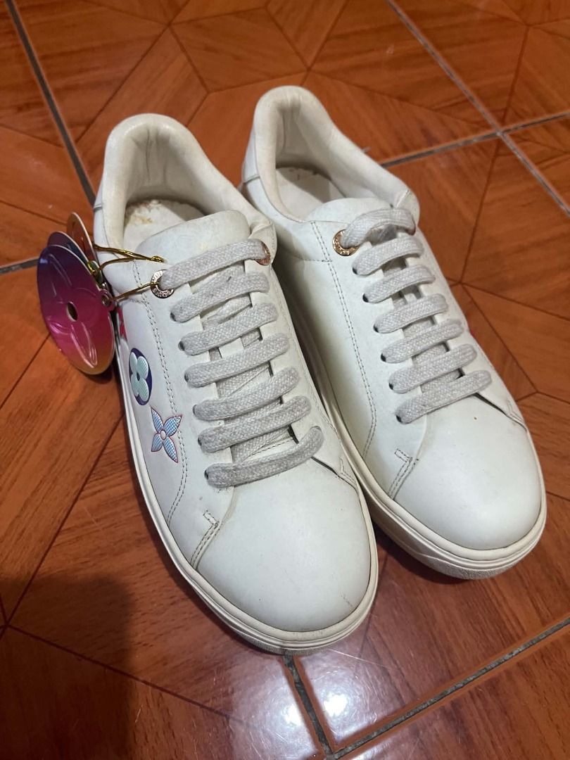 Louis Vuitton White Leather Sneakers Size 37 (Class A) (Category: Sneakers) located in Caloocan City. Submitted by kcprintshop01-88923 (Listing ID 1465397446, Image 3). Description: - Brand: Louis Vuitton - Color: White with gold-tone hardware - Size: 37 (stamped on midsole) - Material: Premium white leather - Design: Monogram flower motifs on the side and debossed LV Paris lettering on the heel tab - Sole: Thick white platform sole - Condition: 