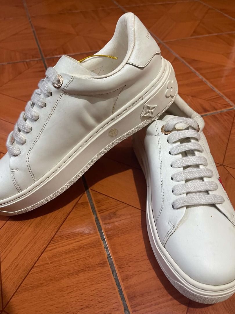 Louis Vuitton White Leather Sneakers Size 37 (Class A) (Category: Sneakers) located in Caloocan City. Submitted by kcprintshop01-88923 (Listing ID 1465397446, Image 2). Description: - Brand: Louis Vuitton - Color: White with gold-tone hardware - Size: 37 (stamped on midsole) - Material: Premium white leather - Design: Monogram flower motifs on the side and debossed LV Paris lettering on the heel tab - Sole: Thick white platform sole - Condition: 