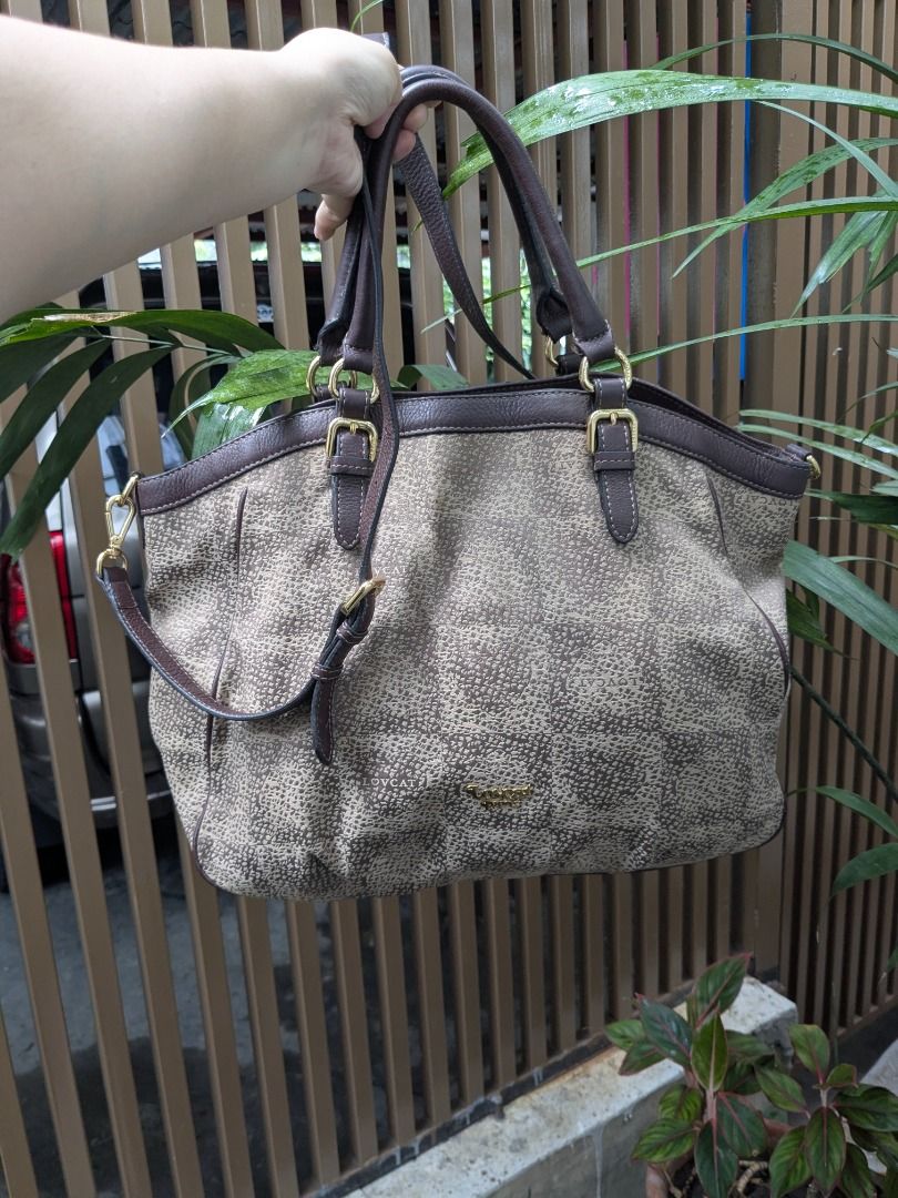 Lovcat Paris 2 Way Bag (Category: Shoulder Bags) located in Quezon City. Submitted by nnncorner (Listing ID 1465516696, Image 1). Description: Lovcat Paris Monogram Canvas 2 Way Bag Combination of Canvas and Leather 9/10 condition 100% Original! Good as new Complete Bag Feet Strap down to bottom - 32 inches Height - 12 inches Width - 17 inches Can be used as Hand Bag or Sling Bag Detachable Strap No tarnising on all gold hardwares Snap lock closu