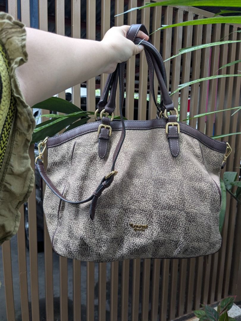 Lovcat Paris 2 Way Bag (Category: Shoulder Bags) located in Quezon City. Submitted by nnncorner (Listing ID 1465516696, Image 2). Description: Lovcat Paris Monogram Canvas 2 Way Bag Combination of Canvas and Leather 9/10 condition 100% Original! Good as new Complete Bag Feet Strap down to bottom - 32 inches Height - 12 inches Width - 17 inches Can be used as Hand Bag or Sling Bag Detachable Strap No tarnising on all gold hardwares Snap lock closu