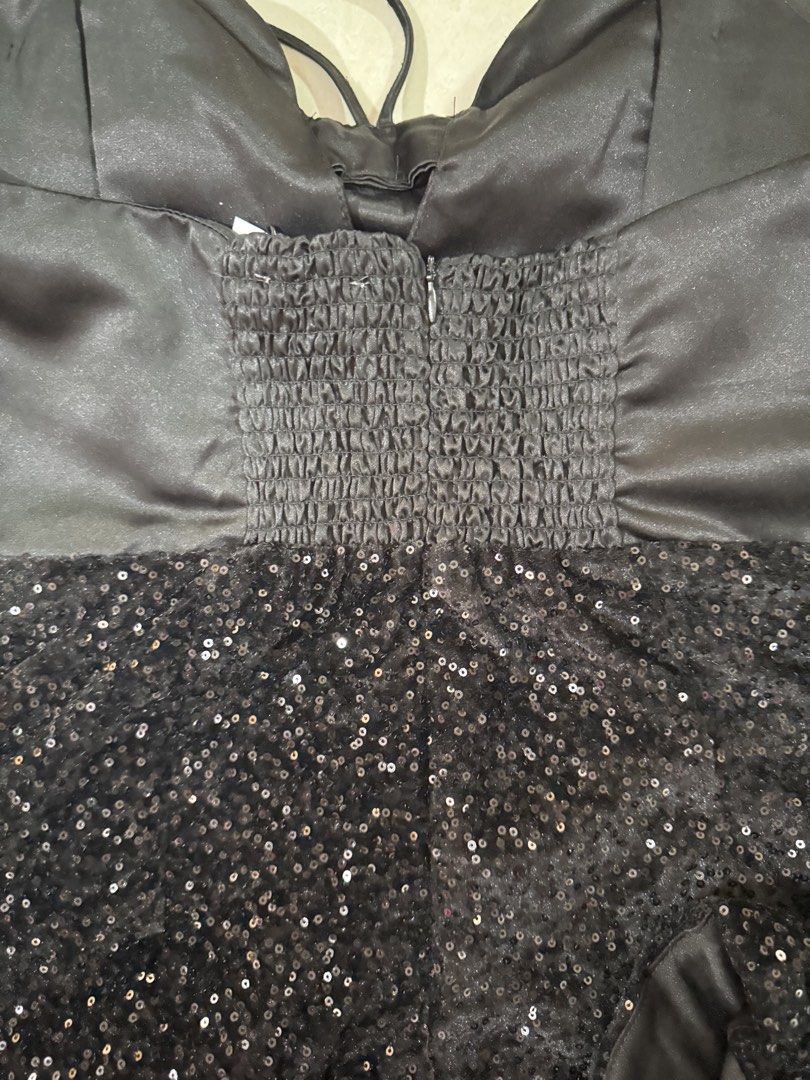 Love, Ara Black Sequin Bow Romper (Category: Rompers) located in Quezon City. Submitted by sweetlyluxe (Listing ID 1465484505, Image 3). Description: - Brand: Love, Ara - Size: Medium - Design: Satin bodice with front bow & adjustable halter straps - Bottom: Sparkly sequin shorts - Closure/Fit: Smocked back panel with side zipper - Condition: Worn once.