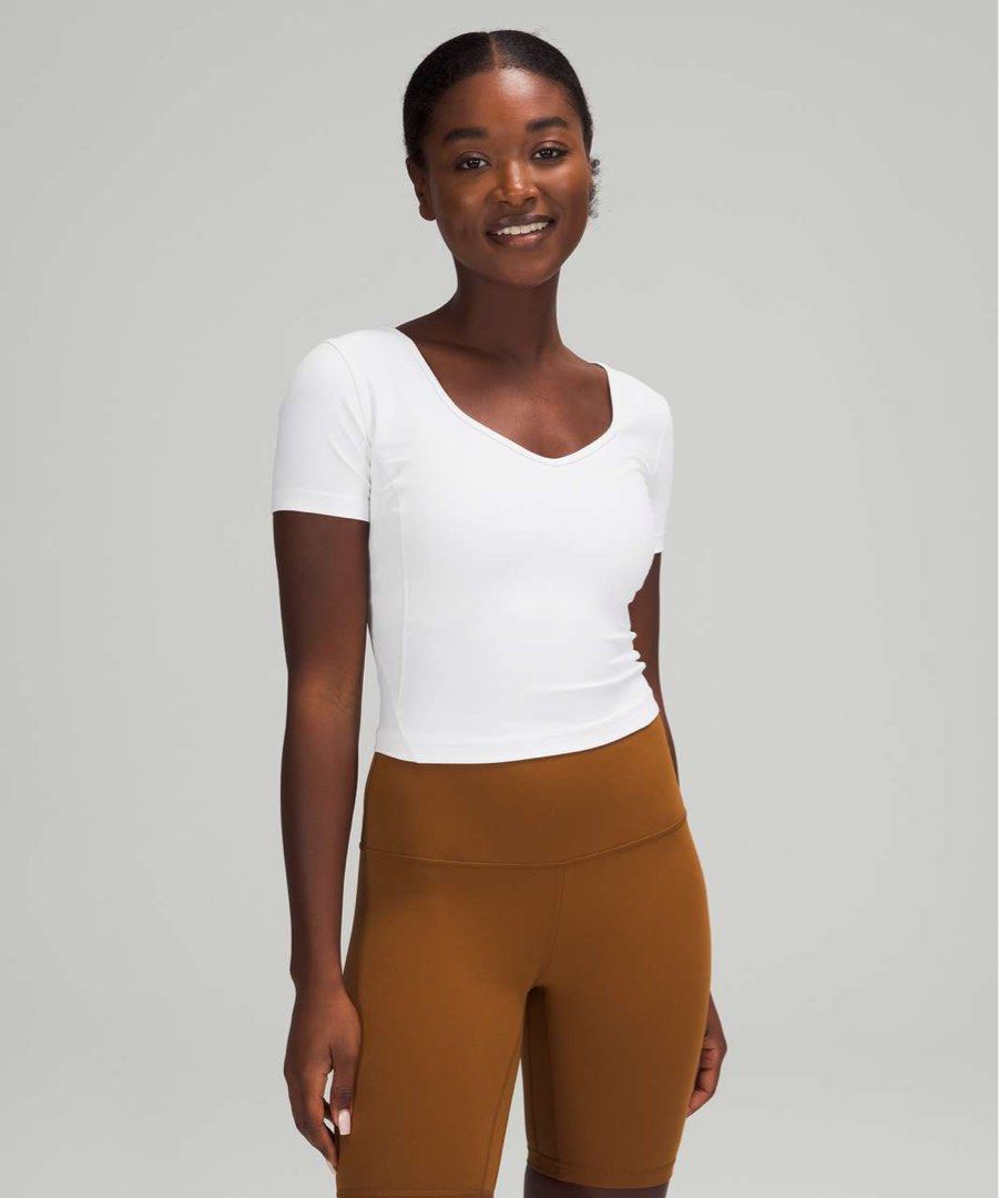 Lululemon Align T-shirt (Category: Activewear) located in Rosales. Submitted by dariang22 (Listing ID 1465413526, Image 3). Description: - Brand: Lululemon 6 on removed tag - Color: White - Style: Short sleeve crop top with a trendy deep scoop back and iconic logo detail - Fabric: Ultra-soft and stretchy for workouts or casual wear - Perfect for gym sessions, runs, or everyday errands! - with color transfer. Ikaw na bahala magbleach.