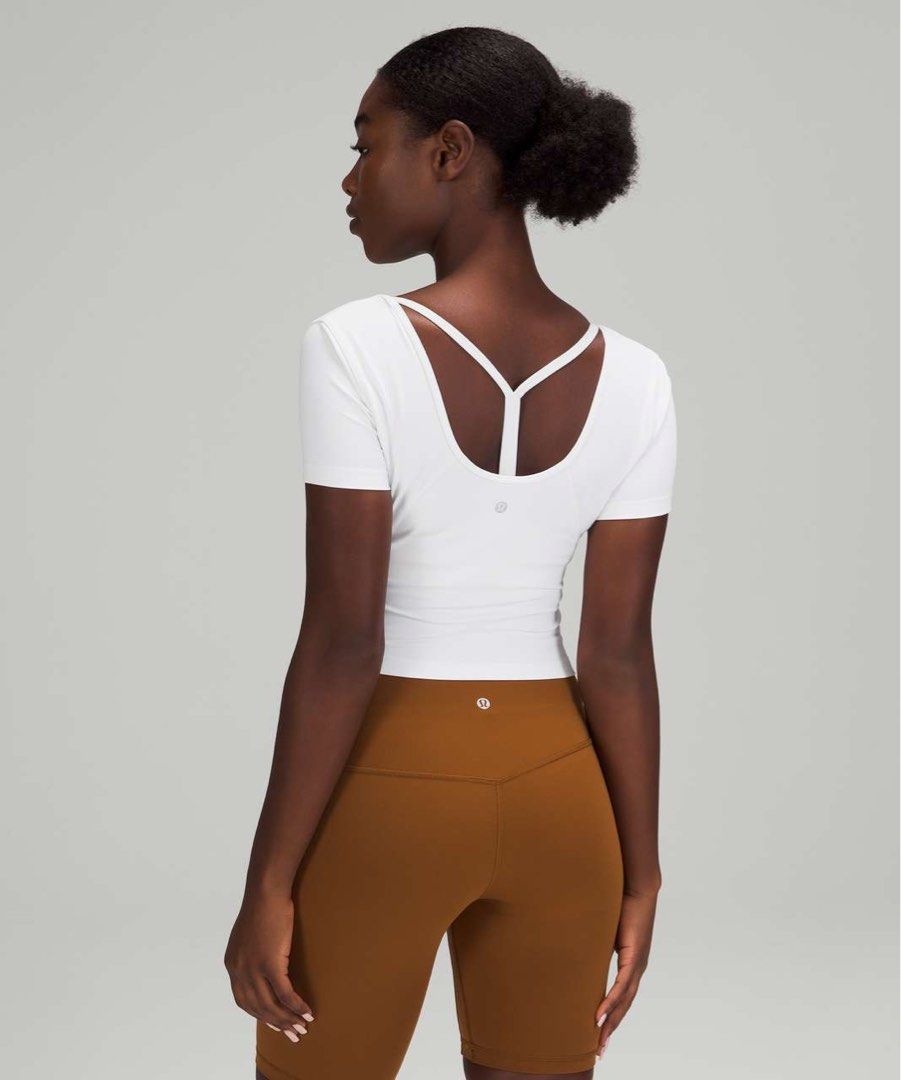 Lululemon Align T-shirt (Category: Activewear) located in Rosales. Submitted by dariang22 (Listing ID 1465413526, Image 1). Description: - Brand: Lululemon 6 on removed tag - Color: White - Style: Short sleeve crop top with a trendy deep scoop back and iconic logo detail - Fabric: Ultra-soft and stretchy for workouts or casual wear - Perfect for gym sessions, runs, or everyday errands! - with color transfer. Ikaw na bahala magbleach.
