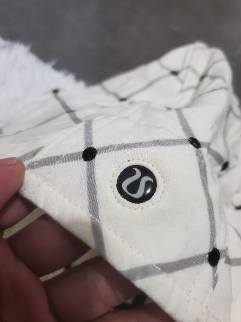 Lululemon Cream Plaid Checkered Long Trench Jacket Coat (Category: Coats, Jackets and Outerwear) located in Manila. Submitted by royalrabbit.7b2a11 (Listing ID 1465515905, Image 3). Description: - Color/Pattern: Cream with dark plaid - Closure: Full zip front with branded pulls - Hood: Removable - Details: Adjustable drawstring toggle with signature logo hardware - Fabric: Lightweight, great for layering - Condition: Clean, worn very few times - 