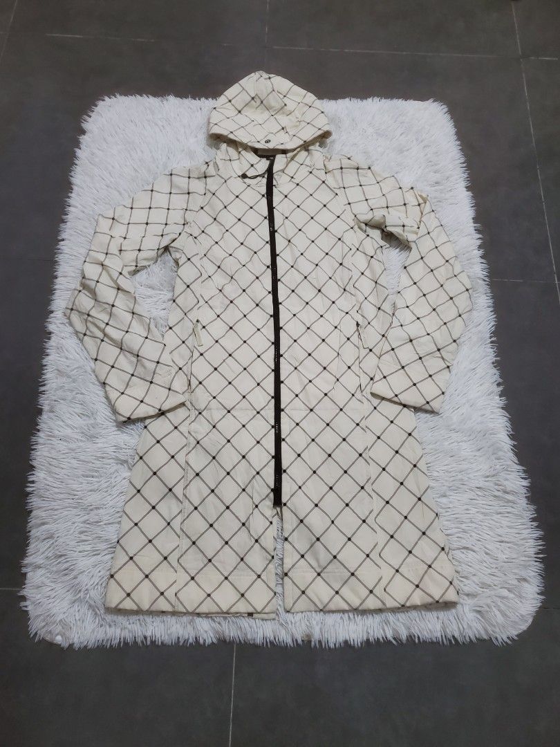 Lululemon Cream Plaid Checkered Long Trench Jacket Coat (Category: Coats, Jackets and Outerwear) located in Manila. Submitted by royalrabbit.7b2a11 (Listing ID 1465515905, Image 1). Description: - Color/Pattern: Cream with dark plaid - Closure: Full zip front with branded pulls - Hood: Removable - Details: Adjustable drawstring toggle with signature logo hardware - Fabric: Lightweight, great for layering - Condition: Clean, worn very few times - 