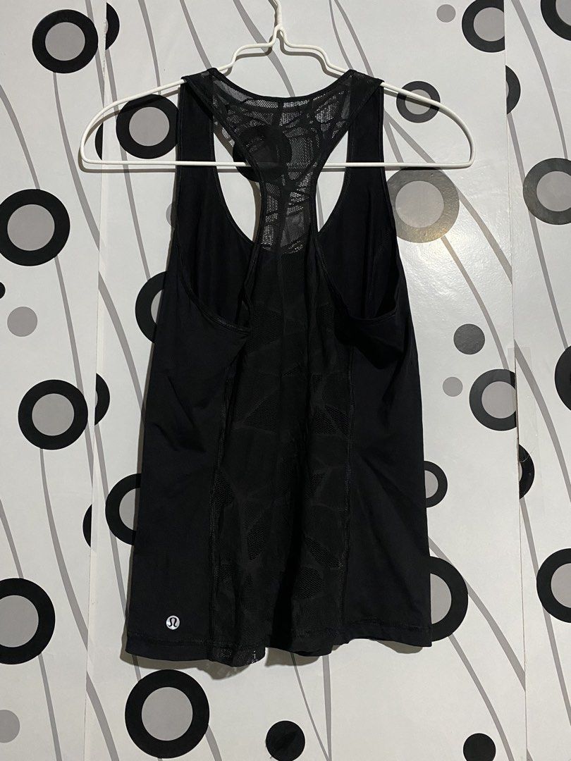 Lululemon Goal Crusher Tank activewear top (Category: Sleeveless) located in Cebu City. Submitted by patspickph (Listing ID 1465450528, Image 2). Description: This is a black Lululemon Goal Crusher Tank activewear top featuring a racerback mesh design and a reflective logo detail. No issue Excellent Condition👍👌Dimensions is width 15inches Length 23 👍👌Drifit Stretchable.