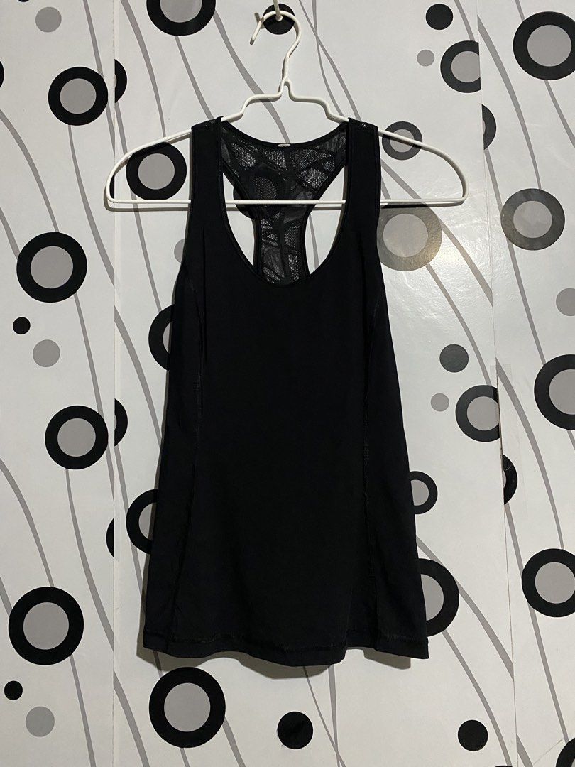 Lululemon Goal Crusher Tank activewear top (Category: Sleeveless) located in Cebu City. Submitted by patspickph (Listing ID 1465450528, Image 3). Description: This is a black Lululemon Goal Crusher Tank activewear top featuring a racerback mesh design and a reflective logo detail. No issue Excellent Condition👍👌Dimensions is width 15inches Length 23 👍👌Drifit Stretchable.