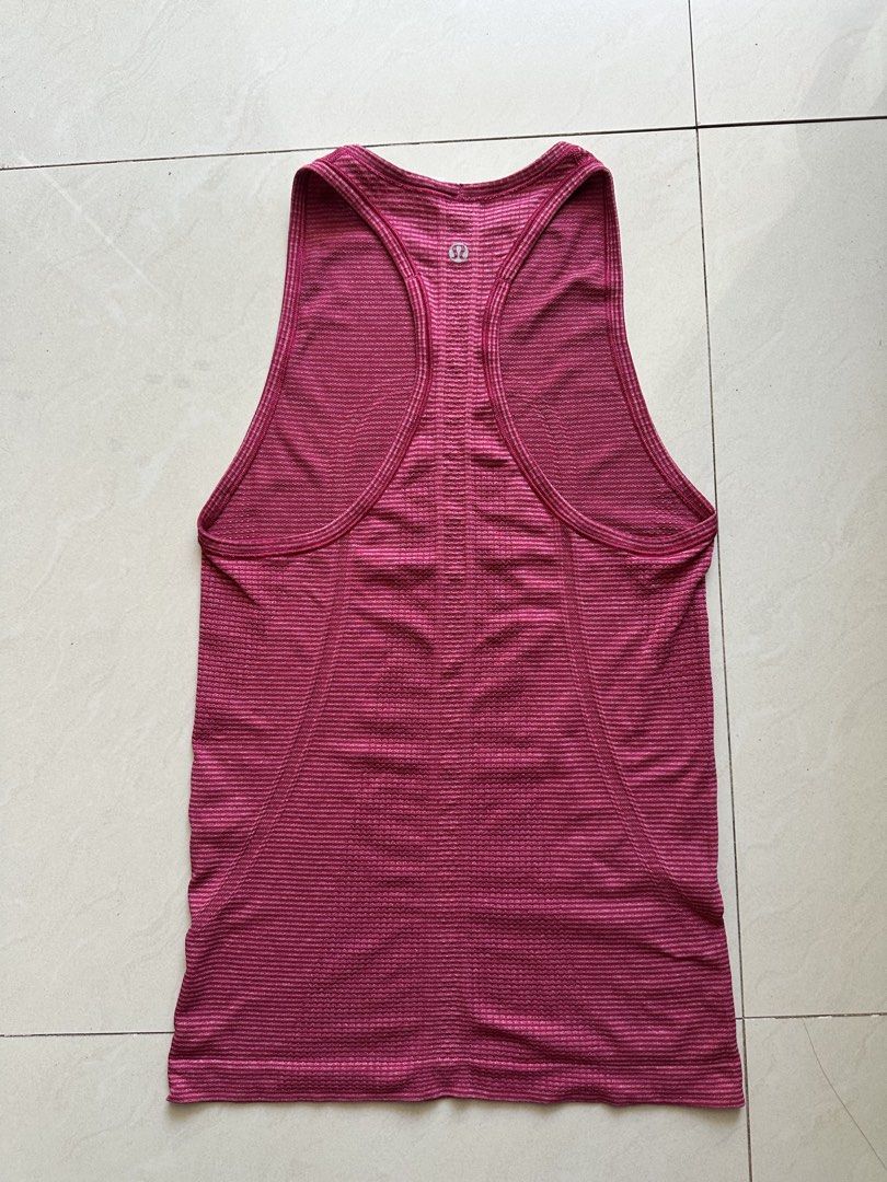 Lululemon Run Swiftly Tech Tank siz e4 (Category: Activewear) located in Rosales. Submitted by dariang22 (Listing ID 1465410131, Image 2). Description: - Brand: Lululemon - Style: Swiftly Tech Tank Top - Color: Pink heathered stripes - Design: Racerback, high neckline, and subtle reflective silver logo at the back - Fabric: Breathable, seamless athletic knit for maximum cooling.