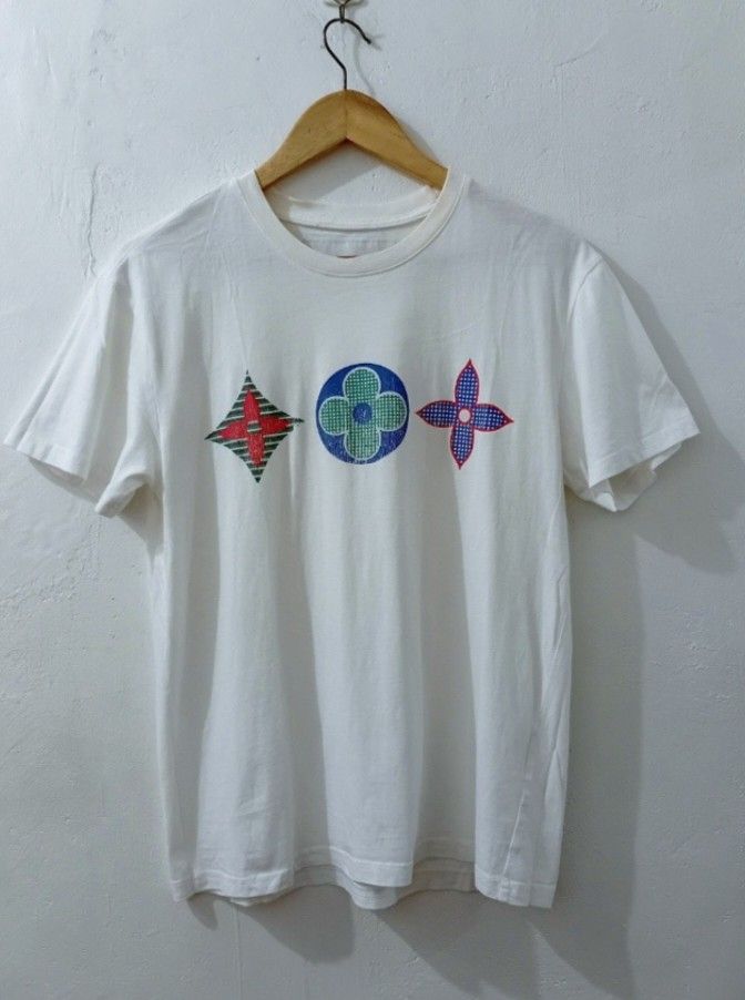 LV Monogram AOP WHiTE TEESHIRT (Category: Luxury Apparel) located in Navotas City. Submitted by ms.soulana (Listing ID 1465494909, Image 1). Description: PREOWNED LIGHTLY USED WellUsed LV Monogram AOP TSHIRT WHITE SMALL-Medium Cotton Sign of Wear Flaws : hairlines sa Prints Good Condition 8.9/10 .