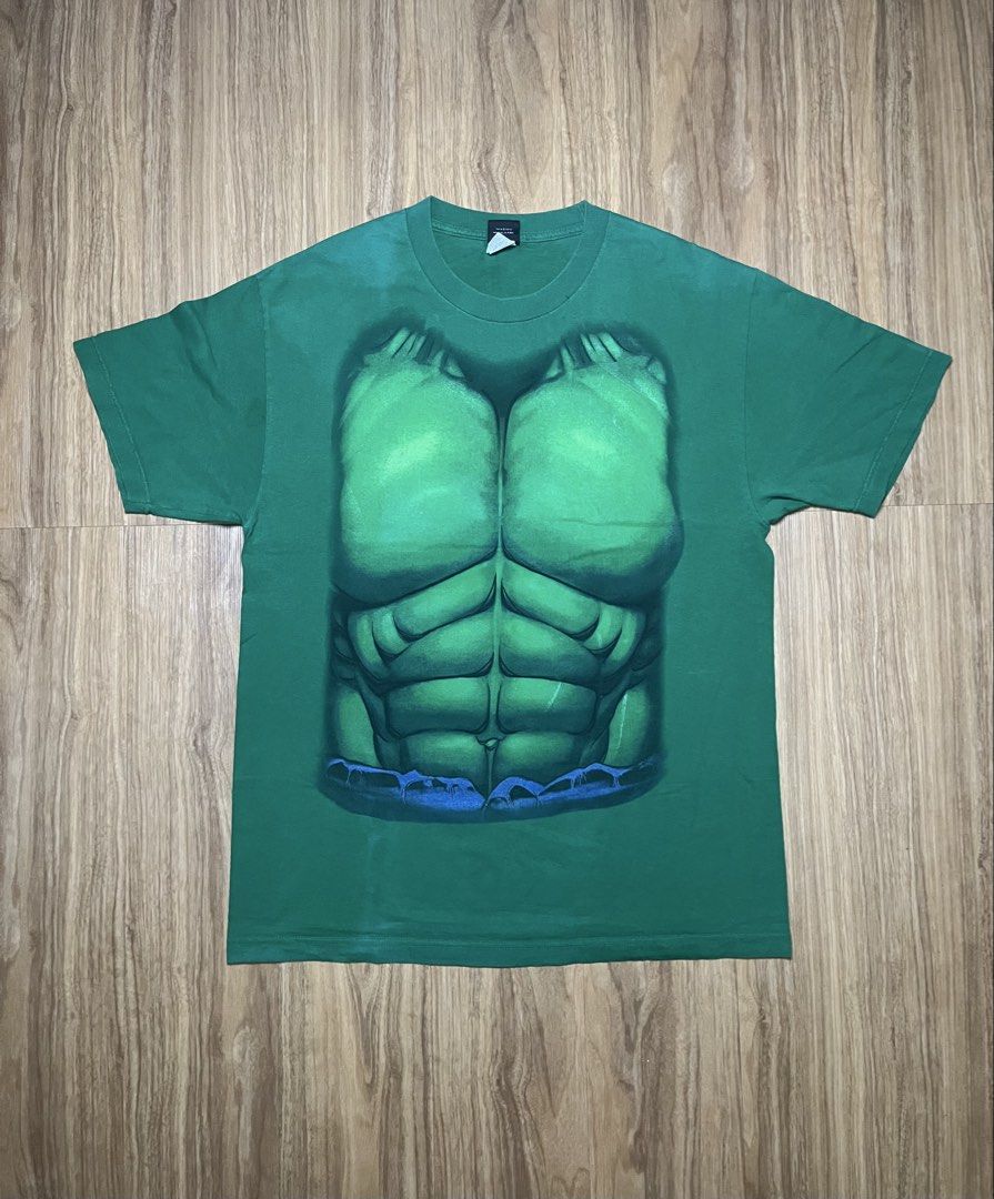 Mad Engine Hulk L•22x30.5 (Category: Tshirts & Polo Shirts ) located in Cebu City. Submitted by guttathreads (Listing ID 1465429768, Image 1). Description: - Brand: Mad Engine (Official Marvel Merchandise 2012) - Size: L (Width: 22 inches, Length: 30.5 inches) - Color: Green - Material: 100% Cotton - Design: Fun Hulk torso & 6-pack abs graphic print - Condition: 7/10 pre-loved condition.