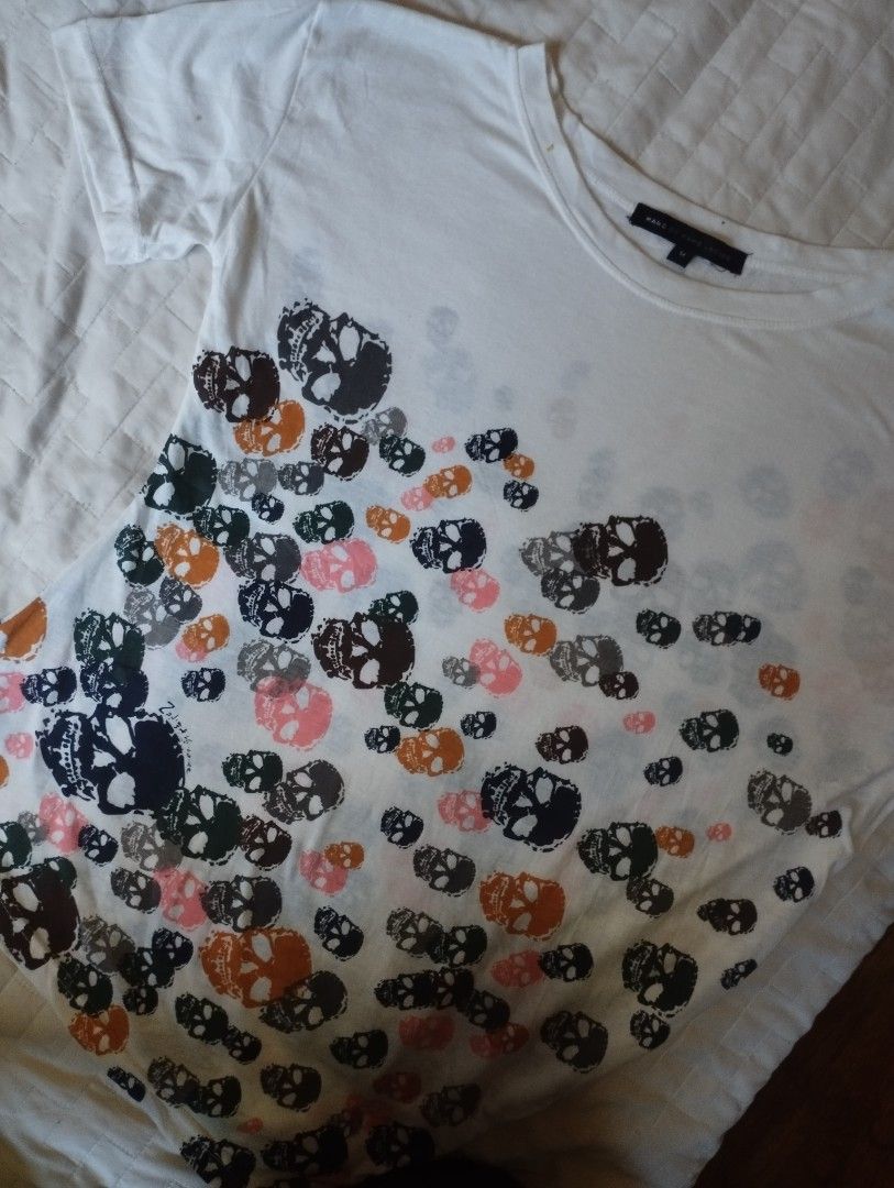 Marc by Marc Jacobs Skull Print T-Shirt (Category: Shirts) located in Manila. Submitted by iamnicka (Listing ID 1465535304, Image 2). Description: - Brand: Marc by Marc Jacobs - Size: Medium (Regular fit) - Color: White with colorful scattered skull print - Style: Short sleeves, crew neck - Condition: Great for casual, everyday wear and easy to match with jeans or shorts.