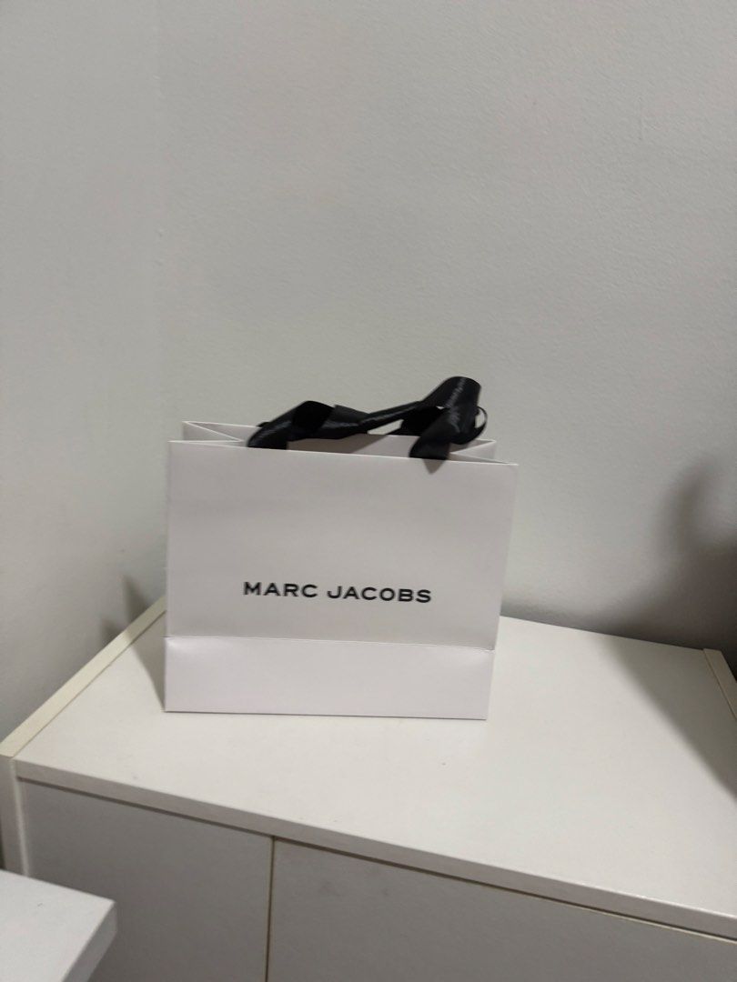 Marc Jacobs Paper Bag (Category: Luxury Bags & Wallets) located in Pasig City. Submitted by roadtominimalism09 (Listing ID 1465532458, Image 2). Description: Paper bag only, got it when I bought fragrance Size: 8.8 x 7.2 x 3.5 .