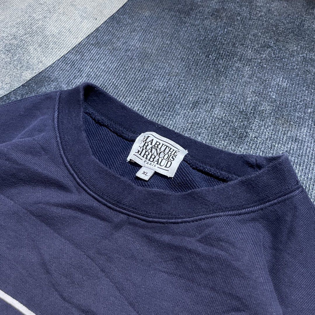 Marithe Francois Girbaud Classic Logo Navy Blue Sweatshirt XL (Category: Coats, Jackets and Outerwear) located in Davao. Submitted by localstashthrift (Listing ID 1465435057, Image 2). Description: - Brand: Marithe Francois Girbaud - Color: Navy blue - Size: XL (Relaxed fit) - Material: Cotton and polyester blend - Design: Big white logo stamped on chest with small oval sleeve patch - Condition: Clean collar, tags intact, excellent ready-to-wear 