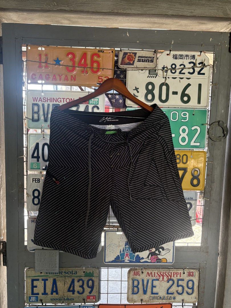 Matix Black White Striped Board Shorts Men (Category: Swim Trunks & Board Shorts) located in Tuguegarao City. Submitted by urdailyhabitat (Listing ID 1465424784, Image 1). Description: - Brand: Matix - Color: Black with white diagonal stripes - Waist: Adjustable drawstring closure with unique patterned drawstrings - Pockets: Includes a secure back zippered pocket - Details: Metal grommets and subtle branding tags on pocket and waistband - Materia
