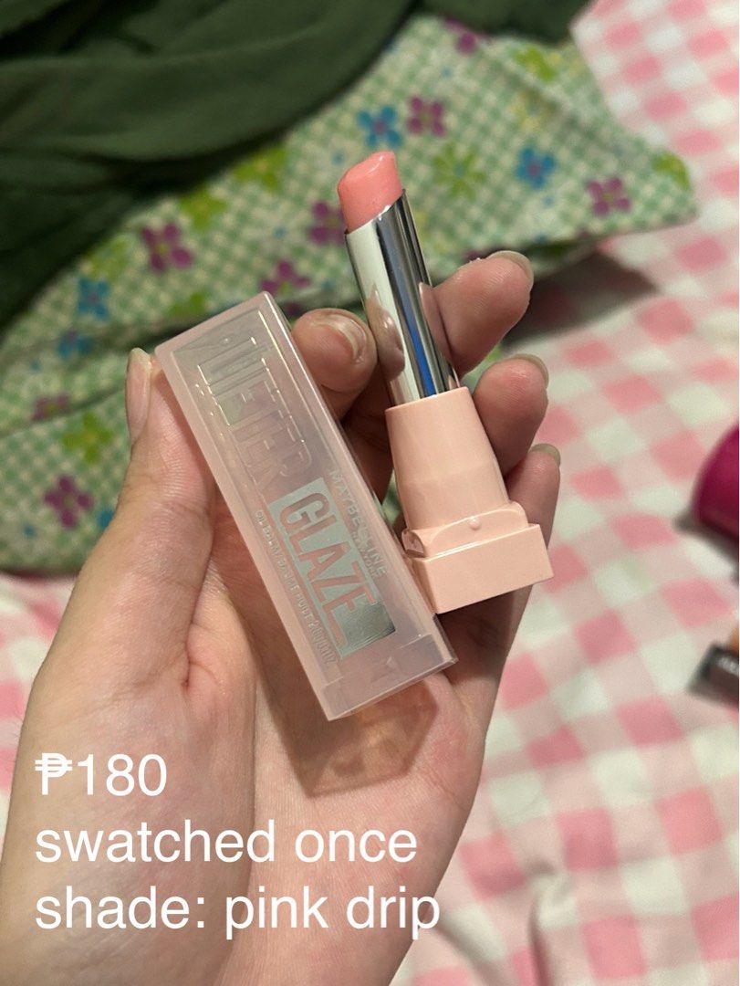 Maybelline Lifter Glaze Oil Balm (Category: Makeup) located in Manila. Submitted by sophialeigh (Listing ID 1465490180, Image 1). Description: - Shade: Pink Drip - Condition: Swatched once for content, practically full product.