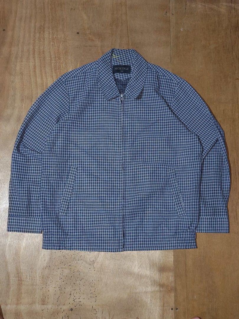 MCKINLY Blue Plaid Zip-Up Jacket (Category: Coats, Jackets and Outerwear) located in Cagayan de Oro. Submitted by epictiger_2a3d62 (Listing ID 1465413032, Image 1). Description: - Brand: MCKINLY - Color/Pattern: Blue and white plaid - Style: Zip-up jacket with classic collar - Pockets: Two front welt pockets - Details: Ribbed hem and buttoned cuffs - Fit: Easy to layer, ideal for casual wear - Condition: Clean and well-maintained - Need wash.