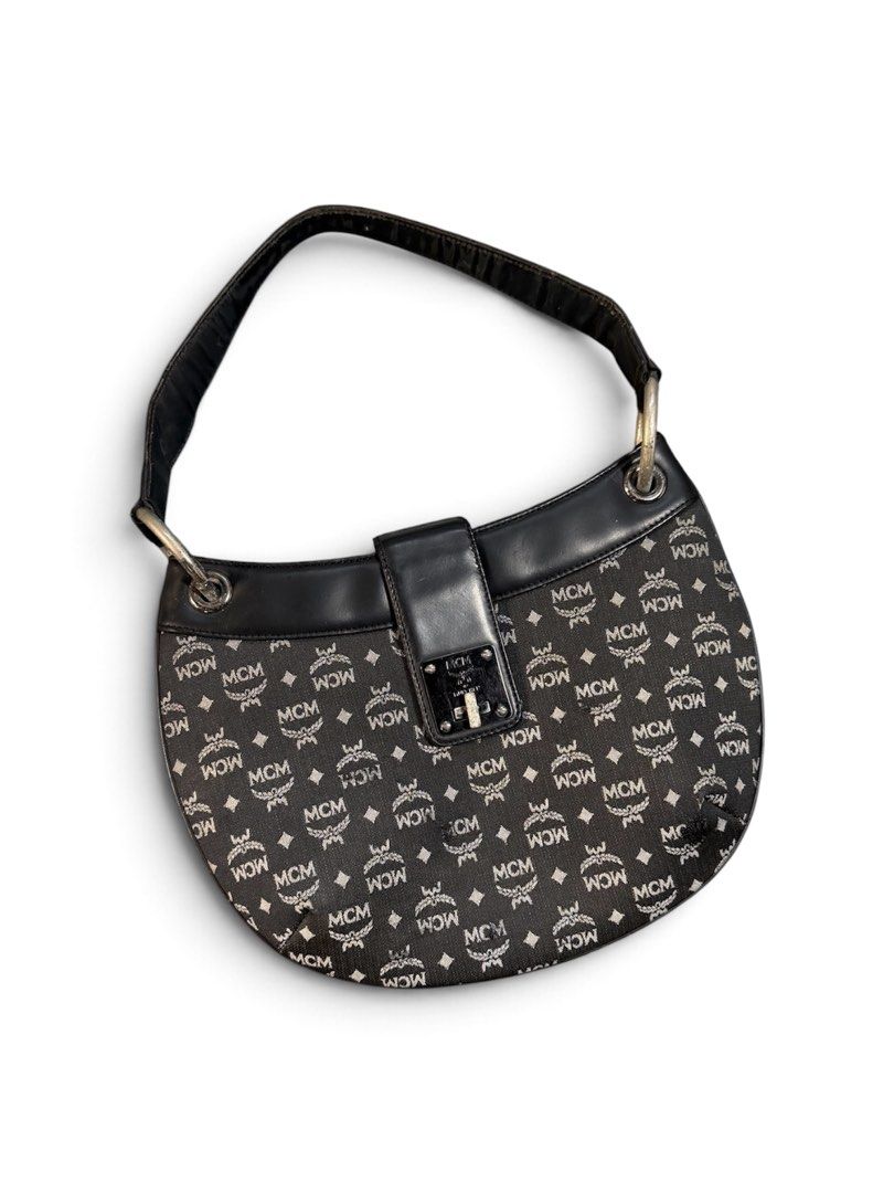 MCM Black Monogram Canvas Shoulder Bag (Category: Luxury Bags & Wallets) located in San Lorenzo. Submitted by thriftnigeorge (Listing ID 1465387991, Image 1). Description: ISSUE INCLUDED IN PHOTOS 9.8/10 COLOR RATE .