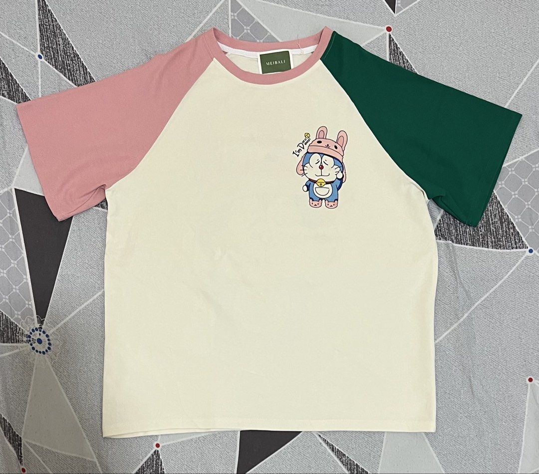 Meibali Doremon (Category: Shirts) located in Caloocan City. Submitted by zachlevi2020 (Listing ID 1465490693, Image 2). Description: Doremon Good as New Boxy type Large Actual Dimes W-22 L-26.5.