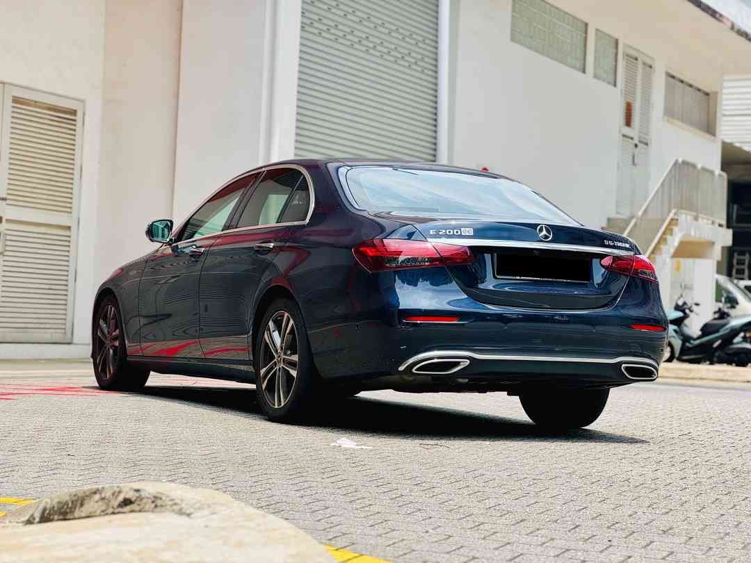 Mercedes-Benz E-Class Saloon E200 Avantgarde (A) (Category: Used Cars) located in Singapore. Submitted by carbuyersclub (Listing ID 1465438214, Image 3). Description: CarBuyers Club - 550+ Google Reviews, SGCM Premium Dealer 2026! Newly arrived C&C agent unit, premium German sedan! Fully agent maintained since day 1 with 2 more free servicing to go! Extremely low mileage used! Classy metallic Brilliant Blue bodywork against tan leather upholstery