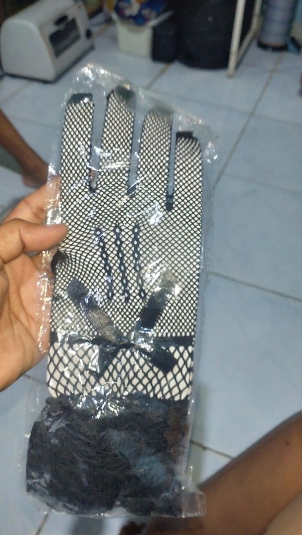Mesh gloves lace 5pair (Category: Gloves) located in Valenzuela. Submitted by diane.35 (Listing ID 1465492371, Image 1). Description: - Style: Five-finger black fishnet gloves with patterned mesh - Accents: Cute small black bow and delicate ruffle lace trim at the wrist - Condition: Brand new, each pair comes in individual plastic packaging - Availability: Multiple pairs in stock, perfect for concerts, parties, or everyday edgy fashion!.
