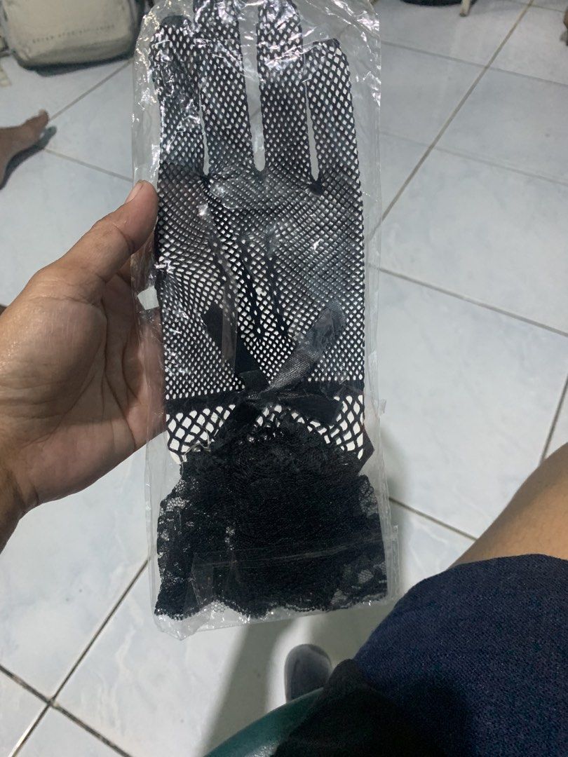 mesh gloves lace (Category: Gloves) located in Valenzuela. Submitted by diane.35 (Listing ID 1465454045, Image 2). Description: - Color: Black - Style: Full finger fishnet mesh gloves - Details: Elegant ruffled lace cuff with a small black ribbon bow - Condition: Brand new, still sealed in original clear plastic packaging - Perfect for costumes, goth/punk fashion, or themed events.
