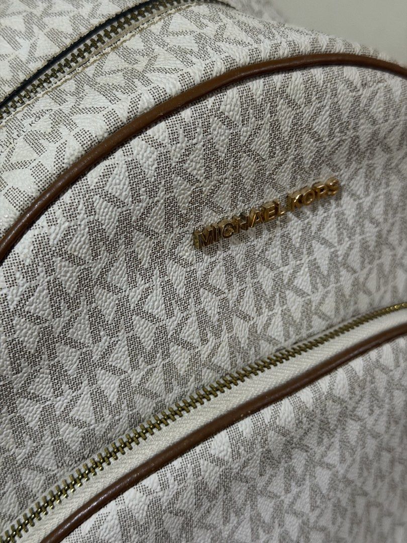 Michael Kors Abbey Backpack (large) (Category: Backpacks) located in Iloilo. Submitted by rynettefrac (Listing ID 1465488798, Image 3). Description: - Brand: Michael Kors (Original) - Design: Classic vanilla and brown monogram print with brown leather trim - Hardware: Gold-tone hardware with MK front lettering - Compartments: Convenient front zip pocket and spacious main interior - Flaws on the straps - Iloilo Based.
