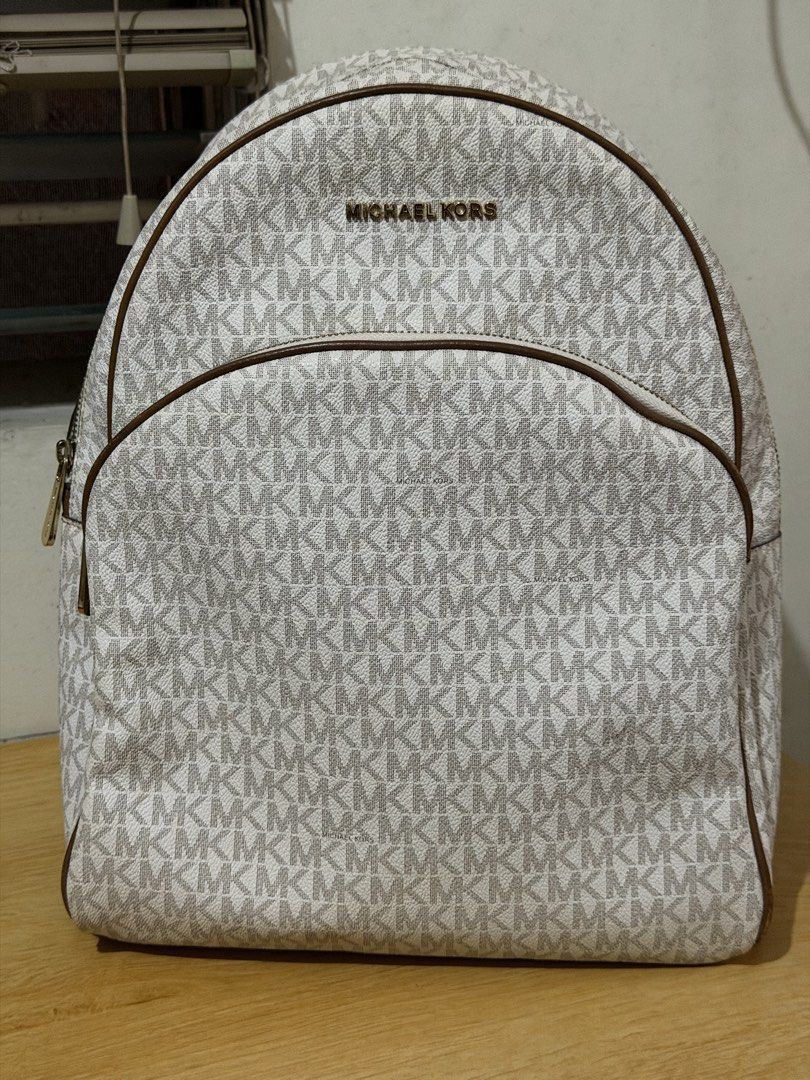 Michael Kors Abbey Backpack (large) (Category: Backpacks) located in Iloilo. Submitted by rynettefrac (Listing ID 1465488798, Image 1). Description: - Brand: Michael Kors (Original) - Design: Classic vanilla and brown monogram print with brown leather trim - Hardware: Gold-tone hardware with MK front lettering - Compartments: Convenient front zip pocket and spacious main interior - Flaws on the straps - Iloilo Based.