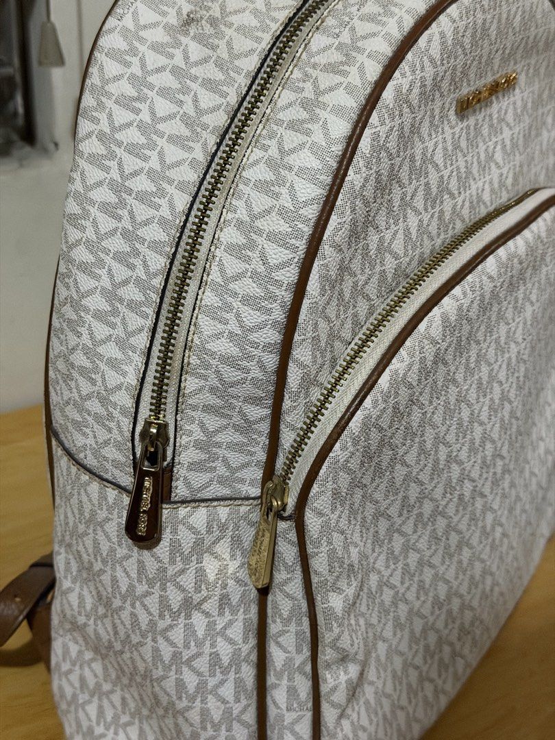 Michael Kors Abbey Backpack (large) (Category: Backpacks) located in Iloilo. Submitted by rynettefrac (Listing ID 1465488798, Image 2). Description: - Brand: Michael Kors (Original) - Design: Classic vanilla and brown monogram print with brown leather trim - Hardware: Gold-tone hardware with MK front lettering - Compartments: Convenient front zip pocket and spacious main interior - Flaws on the straps - Iloilo Based.