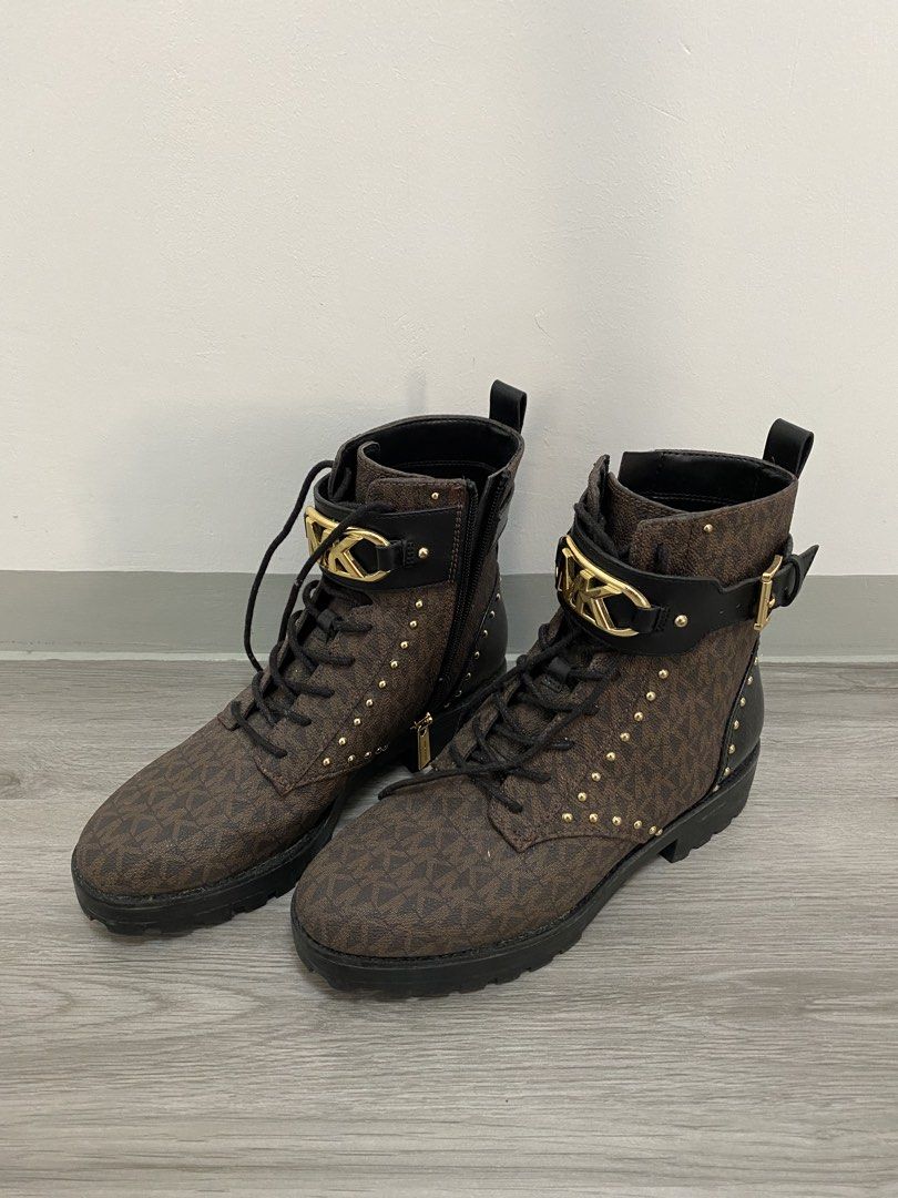 Michael Kors Brown Logo Combat Boots with Gold Hardware (Category: Boots) located in Trece Martires City. Submitted by miladyoo9 (Listing ID 1465465413, Image 2). Description: - Brand: Michael Kors - Style: Combat Boots - Size: 8 - Color/Pattern: Brown monogram with black leather trim - Details: Gold studs, large front MK hardware, side zippers with MK pull tabs - Soles: Lug soles for extra grip and traction - Condition: Excellent buyer-ready con